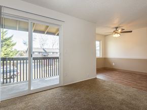 Gresham apartment for rent - a living room with a large window and a ceiling fan