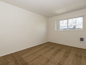 Gresham apartment for rent - a bedroom with a window and a carpeted floor