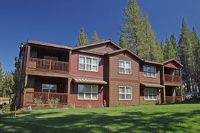 Truckee apartment for rent - a large brown house with trees in the background