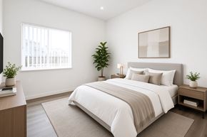 Chico apartment for rent - A bedroom with a large bed and a potted plant on the nightstand.