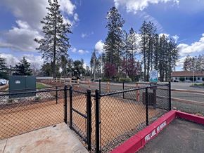 Paradise apartment for rent - A baseball field with a fence and a sign that says Fire Line.