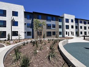 Bay Point apartment for rent - A modern building with a pool in front.