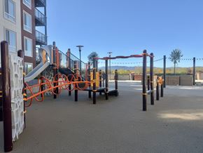 Concord apartment for rent - A playground with a slide and climbing structures.