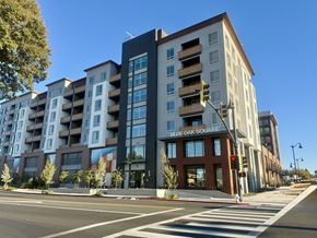 Concord apartment for rent - A street view of a building named Blue Oak Square with a traffic light on the right.