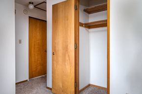 Milwaukie apartment for rent - a bedroom with two closets and a carpeted floor