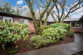 Milwaukie apartment for rent - a brick house with a sidewalk in front of it