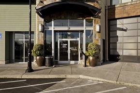 Gresham apartment for rent - A building with a large glass door and a sign that reads 777 on it.