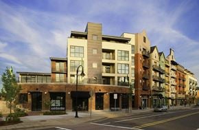 Gresham apartment for rent - A street view of a row of modern buildings.