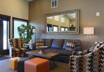 Ridgefield apartment for rent - a living room with couches and chairs and a mirror