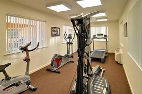 Anderson apartment for rent - a gym with exercise equipment in a room with windows