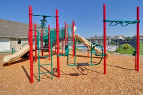 Oakley apartment for rent - a playground with a slide and monkey bars