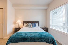 Happy Valley apartment for rent - a bedroom with a bed and a large window