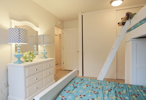Beaverton apartment for rent - a bedroom with a bed and a mirror and a closet