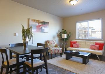 Ridgefield apartment for rent - a living room and dining room with a table and couch