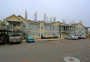 Winters apartment for rent - a row of apartment buildings with cars parked in a parking lot