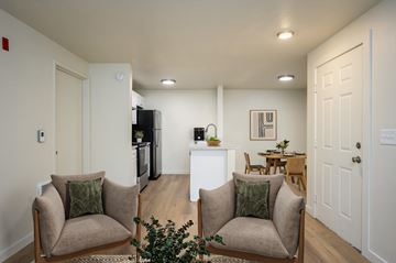 Beaverton apartment for rent - A living room with two chairs and a table in the middle.