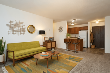 Portland apartment for rent - A living room with a green couch and a coffee table.