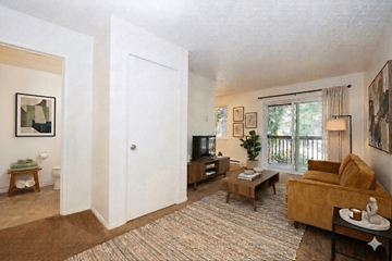 Portland apartment for rent - A living room with a brown rug and a yellow couch.