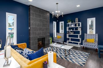 Birmingham apartment for rent - A living room with a yellow sofa and a fireplace.