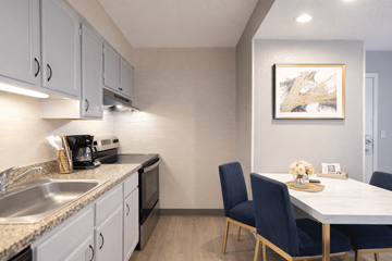 Eagan apartment for rent - A kitchen with a table and chairs.