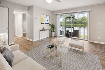 St Petersburg apartment for rent - A living room with a white couch and a grey rug.