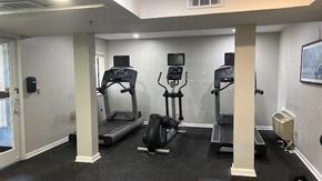 Lombard apartment for rent - A gym with treadmills, weights, and exercise equipment.