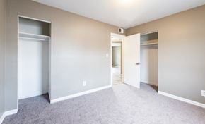 Louisville apartment for rent - A room with a carpeted floor and two open doors.