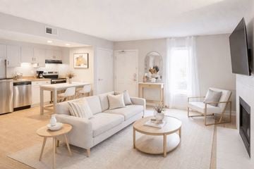 Lombard apartment for rent - A modern living room with a white sofa and a coffee table.