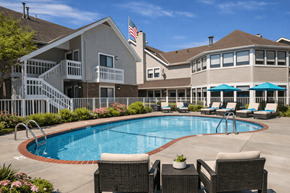 Eagan apartment for rent - A large house with a pool in the backyard.