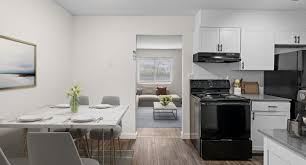 Decatur apartment for rent - A modern kitchen with a dining table set for four.