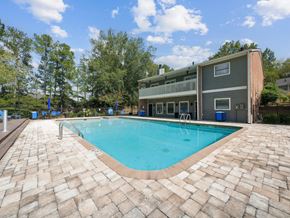 Macon apartment for rent - a swimming pool with a house in the background