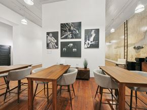 Macon apartment for rent - a dining room with tables and chairs and pictures on the wall