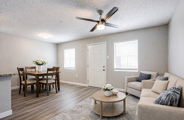 San Antonio apartment for rent - A living room with a dining table and a couch.