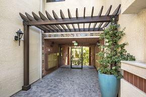 Sherman Oaks apartment for rent - Apartments in Encino, CA - Exterior Walkway with Pergola and Covered Mailbox Area
