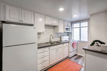 Los Angeles apartment for rent - a kitchen with white cabinets and a white refrigerator