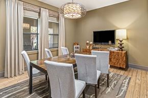 San Antonio apartment for rent - Conference room with a wooden table and grey chairs.