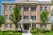 Metuchen apartment for rent - a brick building with a balcony and trees in front of it at Greenway Village Apartments, Metuchen