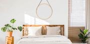 Metuchen apartment for rent - a bedroom with a bed and a mirror on the wall at Greenway Village Apartments, Metuchen, NJ, 08840