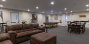 Cedar Grove apartment for rent - a pool table and couches at Zephyr Ridge Apartment Homes, Cedar Grove
