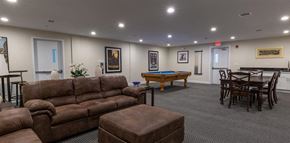 Cedar Grove apartment for rent - a pool table and couches at Zephyr Ridge Apartment Homes, Cedar Grove