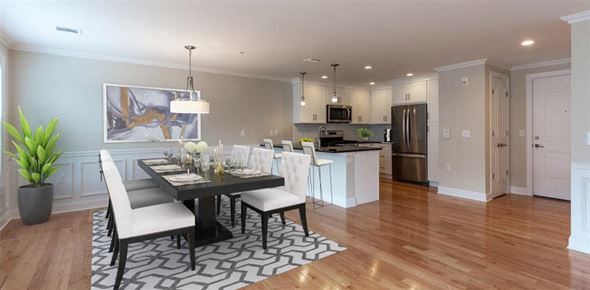 Cedar Grove apartment for rent - a dining room with a table and chairs and a kitchen in the background at Zephyr Ridge Apartment Homes, New Jersey