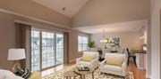 Cedar Grove apartment for rent - a living room with a sliding glass door and a dining room in the background at Zephyr Ridge Apartment Homes, Cedar Grove, 07009