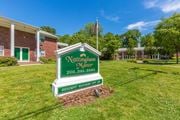Montvale apartment for rent - a green and white sign that says northampton manor in front of a brick building at Nottingham Manor Apartments, Montvale, NJ, 07645