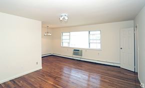 Teaneck apartment for rent - a bedroom with hardwood floors and white walls at Willow Gardens Apartments, Teaneck, 07666