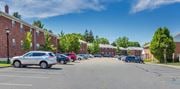 Montvale apartment for rent - a parking lot in front of a brick building at Nottingham Manor Apartments, New Jersey, 07645