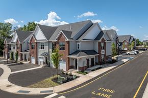 Somerville apartment for rent - A street view of a residential area with houses and a fire lane.