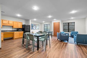 Coralville apartment for rent - A kitchen with a dining table and chairs.