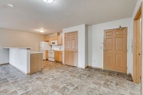 Bloomington apartment for rent - A kitchen with vinyl flooring and a counter.