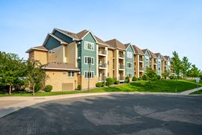 Maple Grove apartment for rent - Apartment complex with a road in front.
