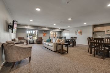 Dayton apartment for rent - an open living room and dining room area with couches and chairs